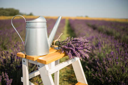 Lavender Bouquet On Wooden Table, On Lavender Field Backgroundの写真素材