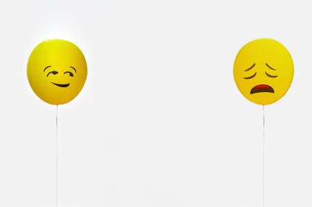 Emotion Face Symbol On Yellow Balloon, Copy Space.の写真素材