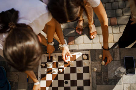 Hand Of Businessman Moving Chess Figure In Competition Board Game For Developの写真素材