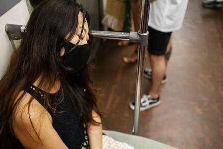Corona Virus. Chinese Coronavirus. Asian Woman In Face Protective Mask Riding In A Subwayn