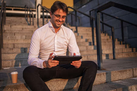 Handsome Happy Businessman Using Tablet Outdoors, Closeup
