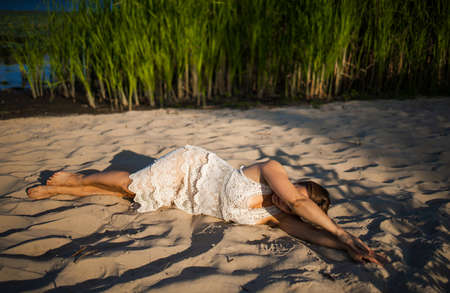 Adult Woman Lay Donw On The Sand Beach Enjoying Summer Sun And Holidayの写真素材