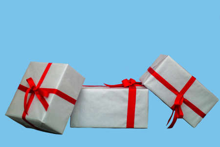 set of gift boxes isolated on blue background, copy space.