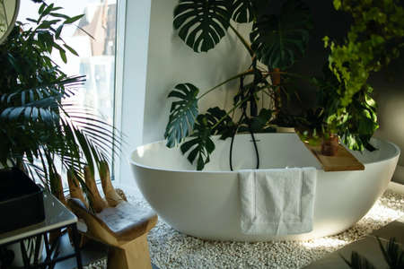 Modern bathroom with gray tiles, seamless, luxurious interior background.の写真素材