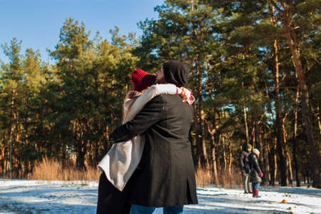 young loving couple on natural winter background.