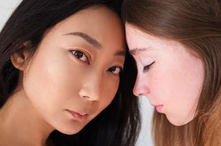 Multi-ethnic beauty. Different ethnicity women Caucasian and Asian.の写真素材
