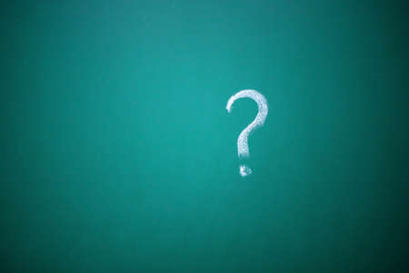 question marks written on the chalkboard. Problems to solve concept.