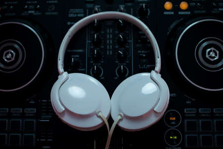 Dj mixer with headphones in a nightclub.の写真素材