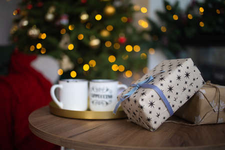 interior christmas. magic glowing tree and gift box.の写真素材