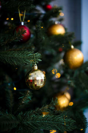 Close up of balls on christmas tree. Bokeh garlands in the background. New Year concept.の写真素材