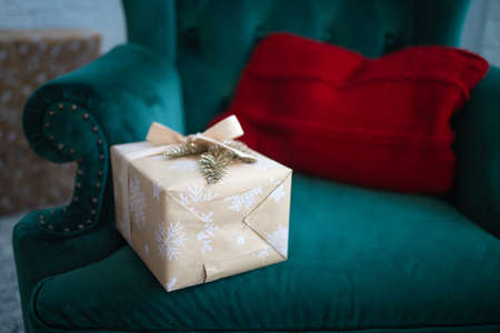 The gift box lies on the blue couchの写真素材