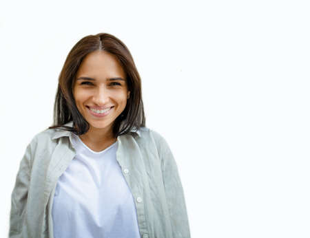 Close-up portrait of nice attractive lovely lovable pretty cute charming girlish funny unsure brown-haired girl looking at camera isolated on white backgroundの写真素材