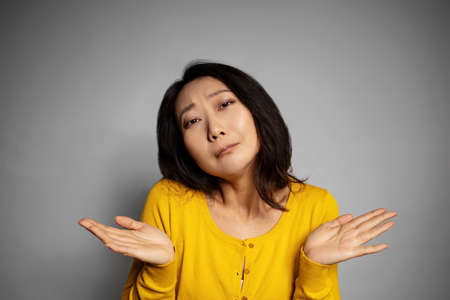 Oops sorry my fault. Portrait awkward guilty cute silly asian woman making mistake apologizing...