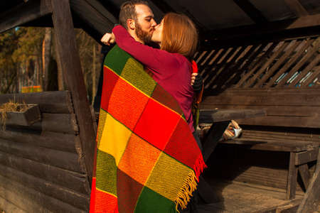 love, relationship, family and people concept - smiling couple hugging in autumn park