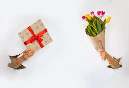 Romantic gift box banner. Online shopping for Valentines Day 2022. Delivery poster. Hand hold a gift...