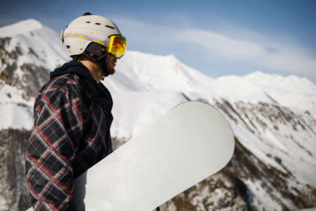Portrait of young man snowboarder. extreme winter sportsの写真素材