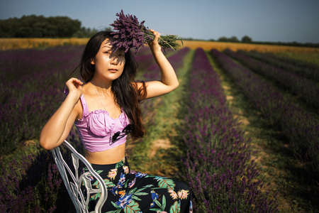 beautiful asian girl in the lavender fieldの写真素材