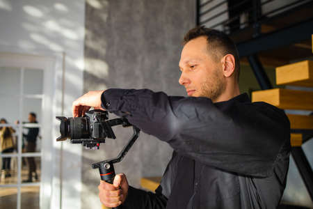 Cameraman shooting by mirrorless camera video.の写真素材