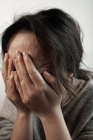 Woman sitting alone and depressedの写真素材