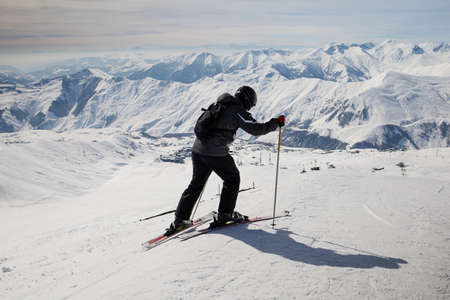Expert skier on relax moment at french alps ski resort - Winter adventure and sport concept with...