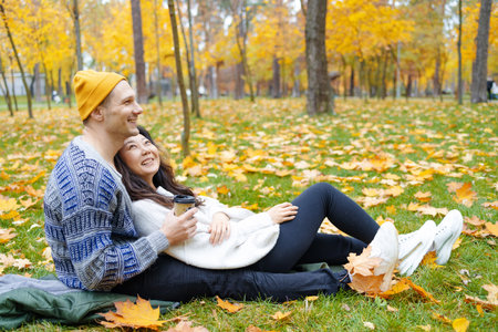 Young couple having fun together in autumn. love. Fashionable couple enjoying autumn. Fashion,...