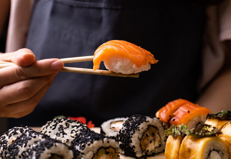 Fresh traditional japanese sushi with salmon on dark background.の写真素材