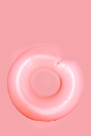 Colorful swim ring isolated on pink background.の写真素材