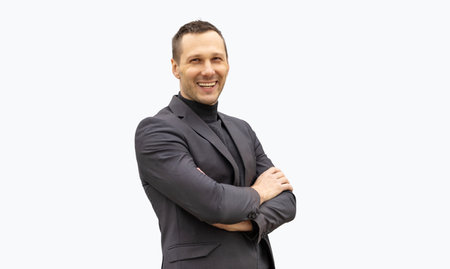 Half-length portrait of business man with crossed hands, isolated on white background.の写真素材