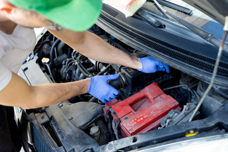 Replacing the car's air filter with a new one, mechanic replace a new filter after diagnostic