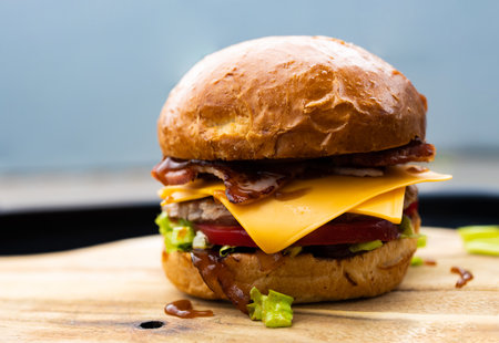 hamburger on a wooden board, close-up, horizontalの写真素材