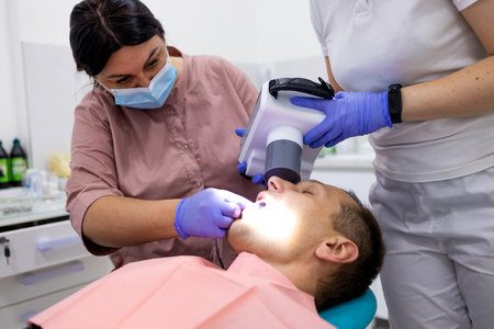 dentist and patient at the dental office. Dental treatment