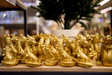 golden dragon for year of the dragon on shelf in a shop, closeup of photoの写真素材