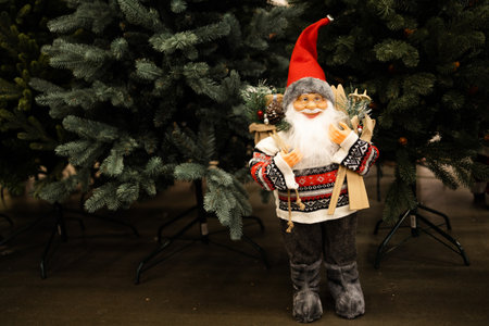 Santa Claus figurine at Christmas tree. Christmas and New Year concept.の写真素材