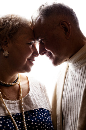 Portrait of a senior couple looking at each other in love.