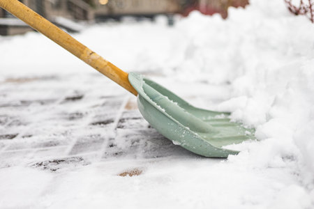 Snow shovel on the street after a blizzard. Selective focus.の写真素材