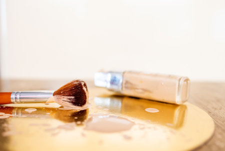 makeup products and accessories to even out skin tone and complexion. Shallow depth of field