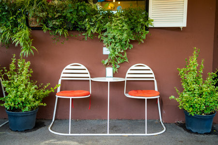 Amidst a deserted cafÃ©, a charming summer terrace beckons with its inviting ambiance, promising a delightful experience for those seeking a moment of relaxation and tranquility.の写真素材