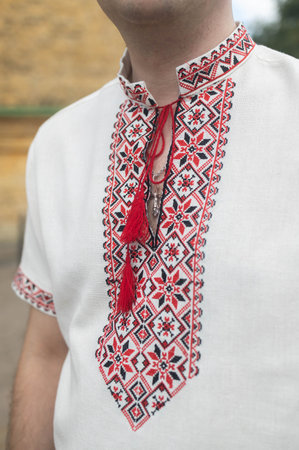 Ukrainian embroidery on the neck of a young manの写真素材