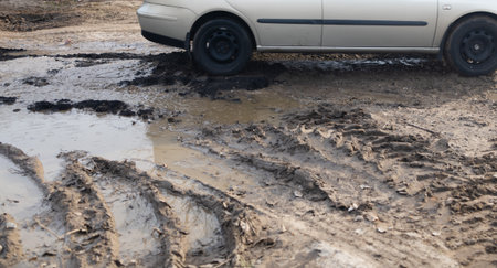 car on the road in the mud, car on the muddy road