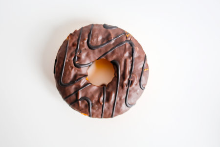 Chocolate donut isolated on white background, top view, copy spaceの写真素材