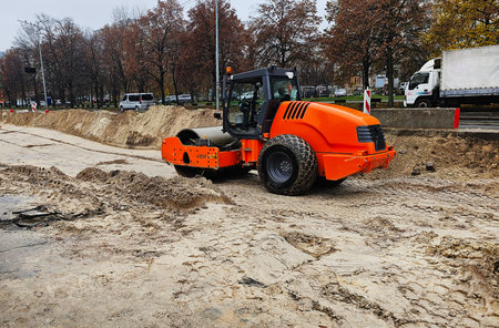 Road repair industry asphalt construction traffic transport. Workers repair the sidewalk and...