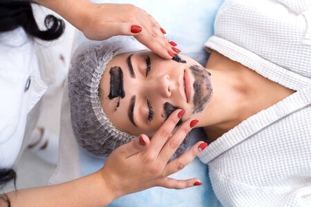 Drawing a black mask.の写真素材