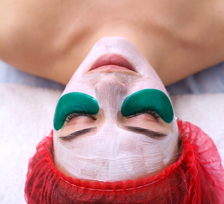 Green moisturizing mask under the eyes.の写真素材