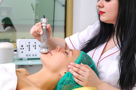 Phonophoresis procedure for a beautiful woman.の写真素材