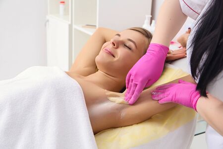 Sugaring: epilation with liquate sugar at armpit.の写真素材