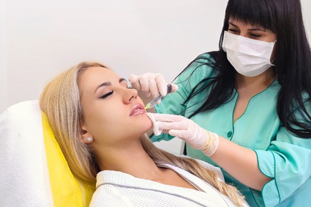 Injection in her lips and face.の写真素材