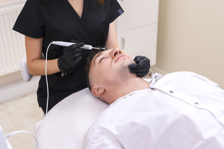 The device is facial cosmetology.の写真素材