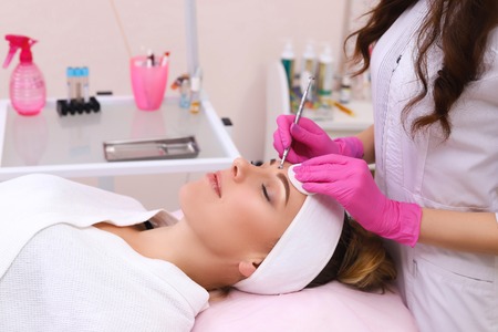 Professional cleansing of acne in a beauty salon.の写真素材