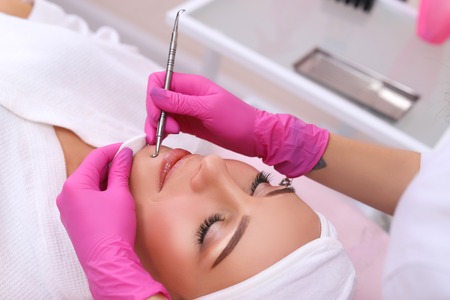 Professional cleansing of acne in a beauty salon.の写真素材