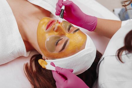 Spa Woman applying Facial cleansing Mask.の写真素材